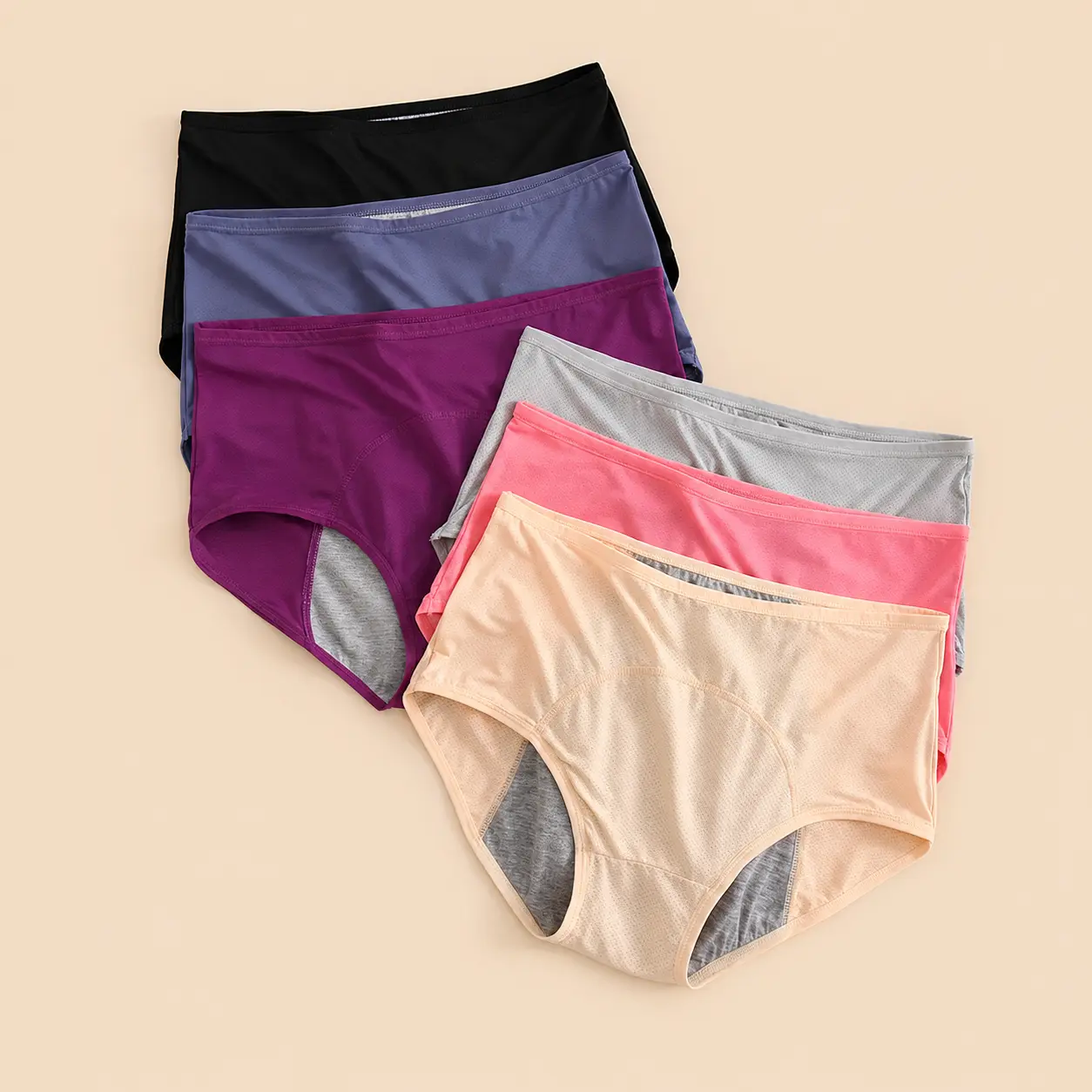 Six colourways of washable leak-proof incontinence underwear fanned out